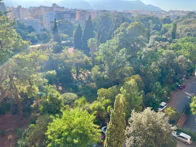 an aerial view of a park with trees and buildings at Dantes House in Palermo