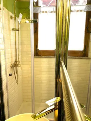 a bathroom with a shower and a sink at Centrale e accogliente Casa Papèl in Palermo