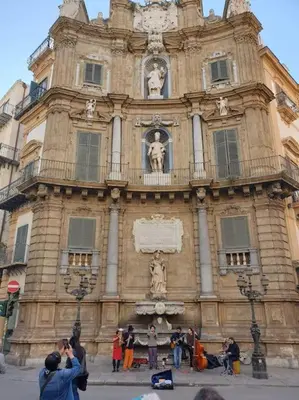 a crowd of people walking down a city street at Studio Bandiera in Palermo