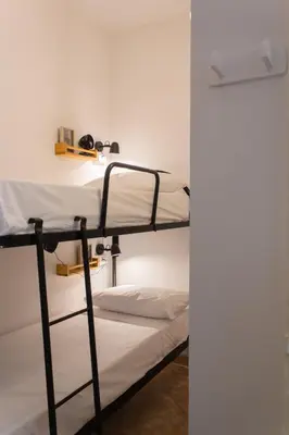 a couple of bunk beds in a room at Casabra in Palermo