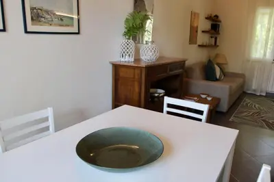 a white table with a bowl on top of it at Villa Enza Bellissima villa con piscina in Terrasini