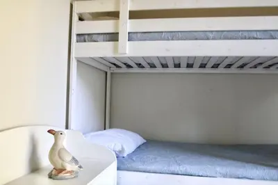 a bedroom with a bunk bed and a toy duck on a dresser at Villa Enza Bellissima villa con piscina in Terrasini