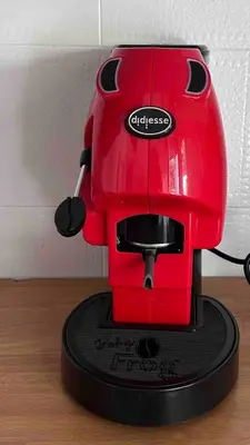 a red coffee maker sitting on top of a table at Villa Marea Mondello in Palermo