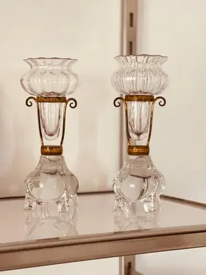 two glass vases sitting on top of a table at casadeb orleans in Palermo
