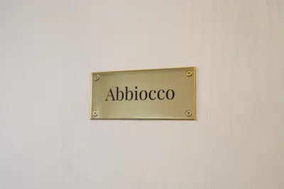 a sign on a wall with the word abjectoco at Casa Disìu in Palermo