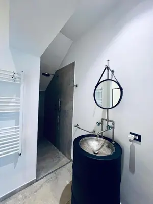 a bathroom with a sink and a mirror at Guest House Colonna apt in Palermo