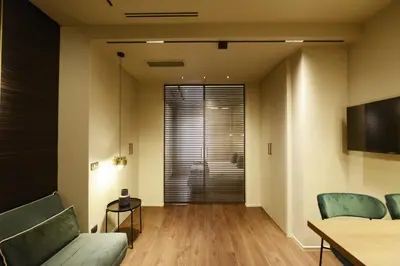 a living room with a couch and a table at Di fronte a Suite in Palermo