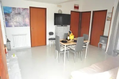 a dining room with a table and chairs at La Via Del Mare in Partinico