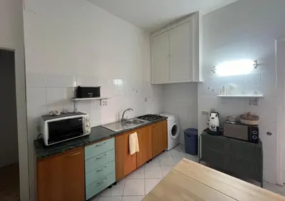 a kitchen with a microwave and a sink at Casa dei nonni di Yuri in Palermo