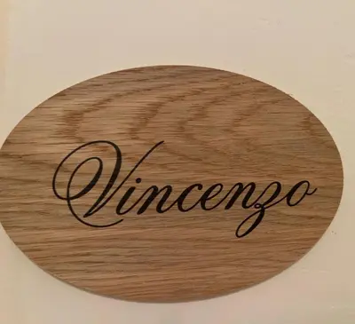 a wood sign with the word surname on it at Casa dei nonni di Yuri in Palermo