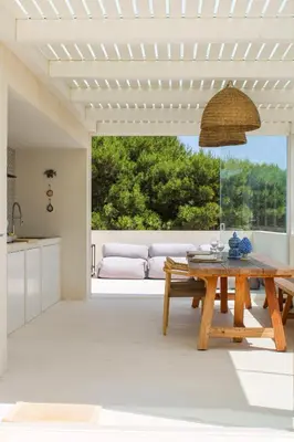a living room with a wooden table and a couch at Villa Ippolita - 2 Bedrooms Apartment with Terrace & Garden Exclusive in San Vito lo Capo