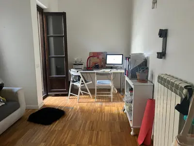 a room with a desk with a computer on it at RoccoLima in Palermo