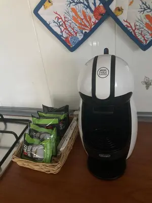 a black and white blender next to a basket of food at Casa Paradiso in Palazzo Adriano