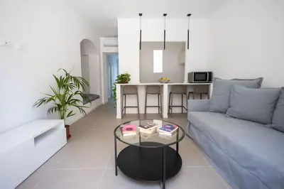 a living room with a couch and a table at iFlat Porta di Mare 45 in Palermo