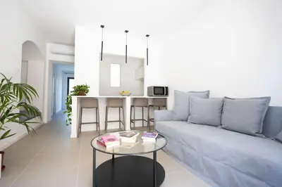 a living room with a couch and a table at iFlat Porta di Mare 45 in Palermo