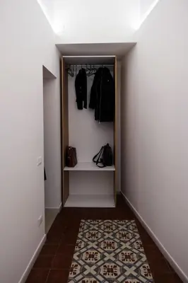 a hallway with a closet with a rug on the floor at Ai Materassai Apartments Palermo in Palermo