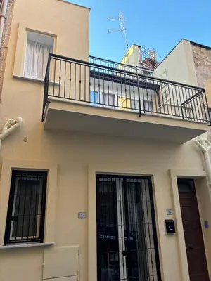 a balcony on the side of a building at Casalabruto in Bagheria
