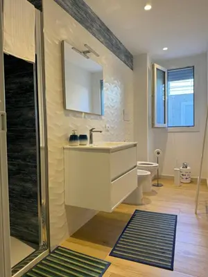 a bathroom with a sink and a shower at Casa cancello a mare in Santa Flavia
