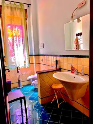 a bathroom with a sink and a toilet at Villa Giovina Mondello in Mondello