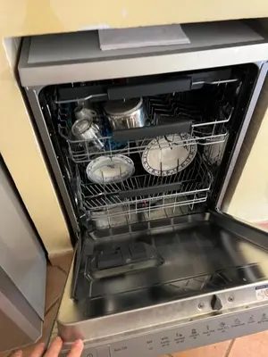 a person holding an oven with two dishes in it at Villa Giovina Mondello in Mondello