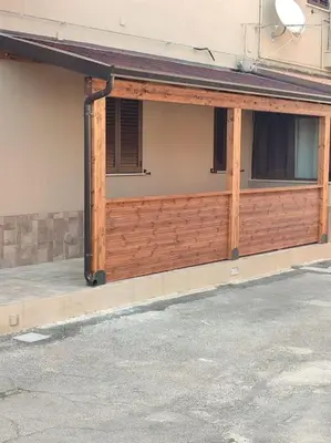 a wooden garage door on a building at Zia Pina Home in Palermo