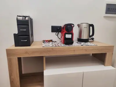 a table with a coffee maker and a coffeemaker on it at Casa Donna Caterina e Don Paolo in Bagheria