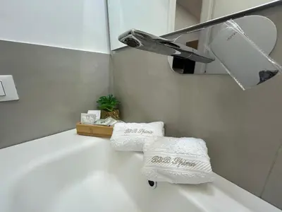 a bathroom with two towels and a sink at Palermo Centro Affittacamere Spina in Palermo