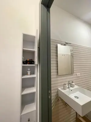 a bathroom with a sink and a mirror at LB SilvioCentro in Palermo