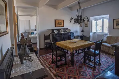 a living room with a table and chairs and a couch at Palermo 3 bedrooms apartment historic center in Palermo
