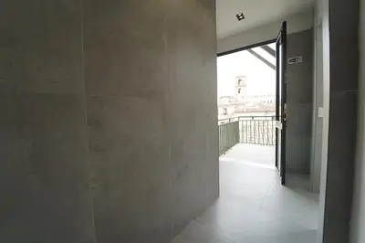 a hallway with a door leading to a balcony at 200 mt Quattro Canti- Appartamento Rovere in Palermo