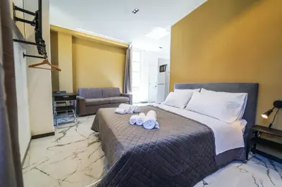 a bedroom with a bed with towels on it at 200 mt Quattro Canti- Appartamento Rovere in Palermo