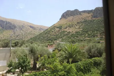 a view of a mountain with a road and trees at Villa Giù, indipendent villa near airport and sea in Cinisi