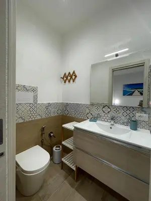 a bathroom with a tub and a toilet and a sink at La Casetta di Isola in Isola delle Femmine