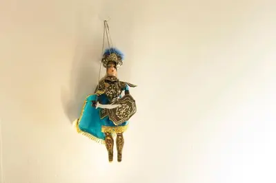 a figurine of a man hanging on a wall at Al Vicolo Palermo in Palermo