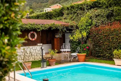 a house with a swimming pool in the yard at Villa Carmen in Mandra Capreria