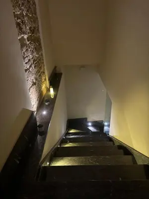 an empty staircase in a building with lights on it at Vittorio Emanuele Suite Apartment in Palermo