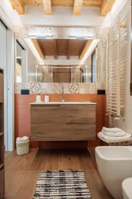 a bathroom with a sink and a tub and a toilet at Villa Michela - Dimora di Charme a Cefalù con panorama sul mare by CEFALU BIZ in Cefalù