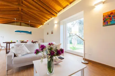 a living room with a couch and a table at Villa dell'Ulivo - by DomuSicily in Terrasini