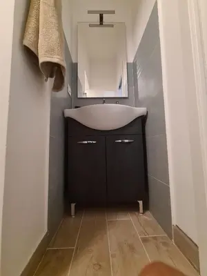 a bathroom with a sink and a mirror at Casa Nenè in Trabia