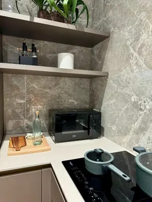 a kitchen with a stove and a microwave at YourLife Suite1 - Deliziosa casa con terrazzino in Palermo