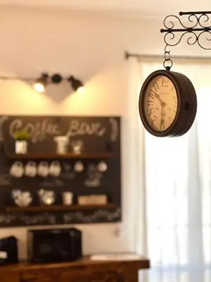 a clock hanging on a wall in a room at Civico 88 in Calatafimi