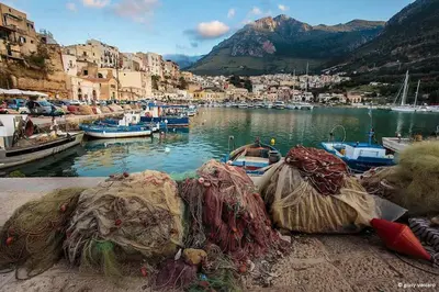 a group of nets on the ground near a harbor at Civico 88 in Calatafimi