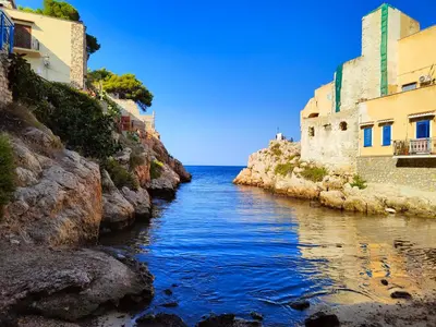a river between two buildings next to the ocean at La Casetta di Mari by Holiday World in Villabate