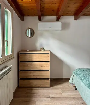 a bedroom with a large bed with towels on it at Moro House in Sferracavallo