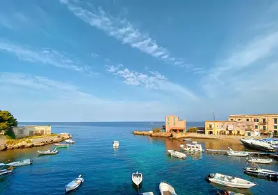 a group of boats in a body of water at Solemar Sicilia - Casa Emma in Porticello