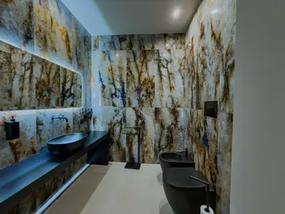 a bathroom with two toilets and a sink at SUPREME Suite&Spa in Palermo