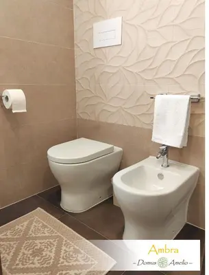 a bathroom with a toilet and a sink at Domus Amelio - Country Rooms in Cinisi