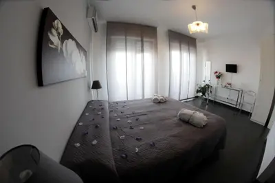 a bedroom with a large bed with rocks on it at Bed and Breakfast Palermo Centro in Palermo