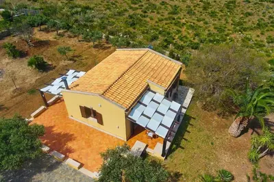 an overhead view of a house with a roof at Villa del Drago in Scopello