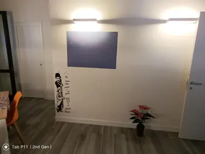 a wall with a picture of a woman on it at Aura's Apartment in Palermo